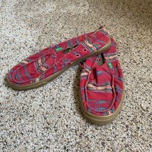 Red sanuk slip ons